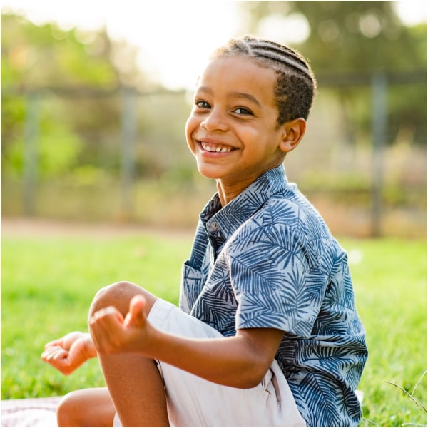 Happy kid is smiling in the park
